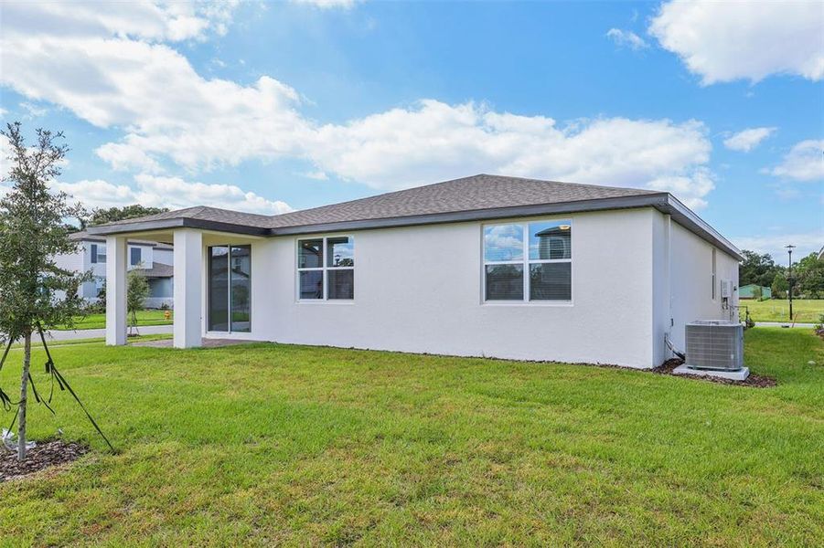 Exterior details and patio area of a home in The Reserve at Twin Lakes, St. Cloud (Image 3).