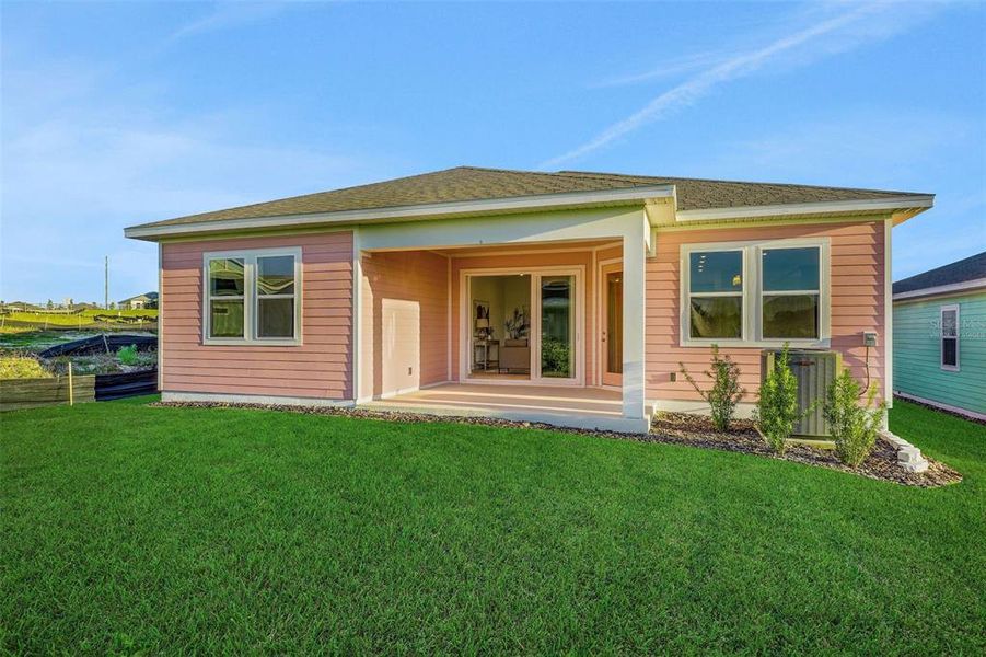 Exterior details and patio area of a home in Green Key Village, Lady Lake (Image 29).