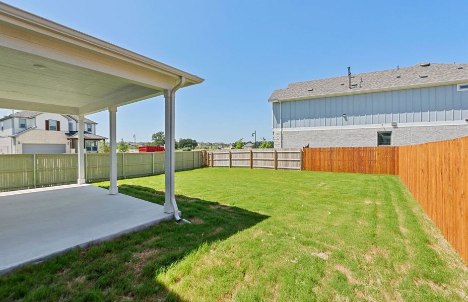 Exterior details and patio area of a home in Santa Rita Ranch, Liberty Hill (Image 25).