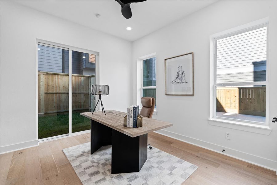 Wrapped in natural light and grounded by warm toned floors, this flexible first-floor room invites calm focus or effortless hospitality. With direct access to the private yard and generous window lines, it blurs the boundary between interior comfort and outdoor ease—perfect as a dedicated workspace, creative studio, or welcoming guest suite. Wrapped in natural light and grounded by warm toned floors, this flexible first-floor room invites calm focus or effortless hospitality. With direct access to the private yard and generous window lines, it blurs the boundary between interior comfort and outdoor ease—perfect as a dedicated workspace, creative studio, or welcoming guest suite.