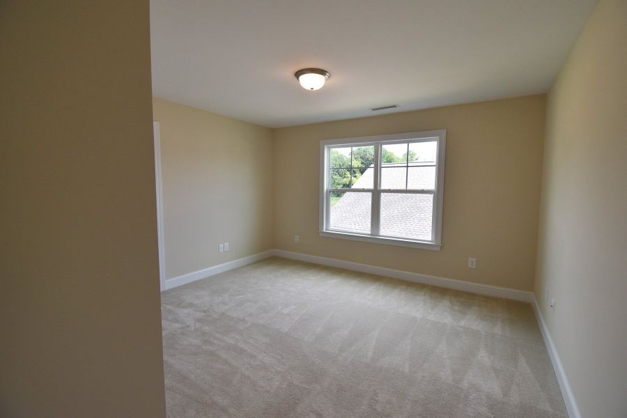 Representative unfurnished interior of a home built from the Cosmopolitan by Keystone Homes NC in Weybridge, Burlington (Image 30).