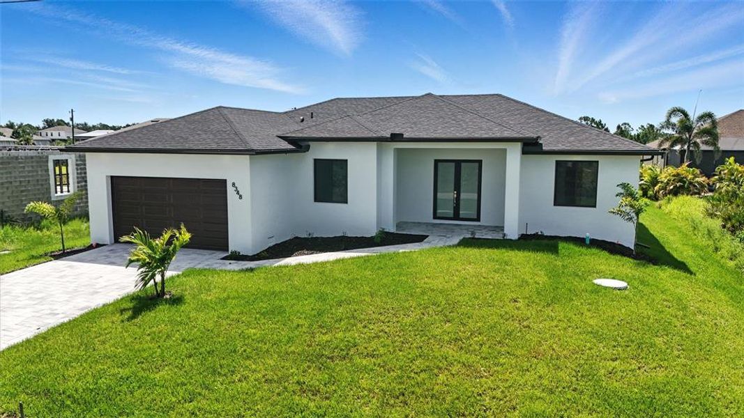 Front exterior of a new home in , Port Charlotte, FL, highlighting curb appeal (Image 18).