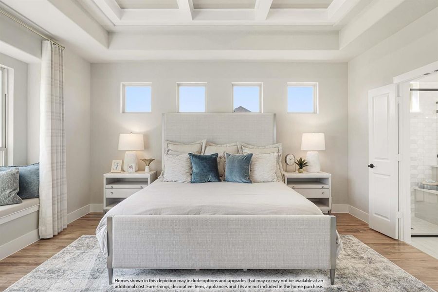 Master bedroom with coffered ceiling, hardwood floors, and ensuite bathroom access