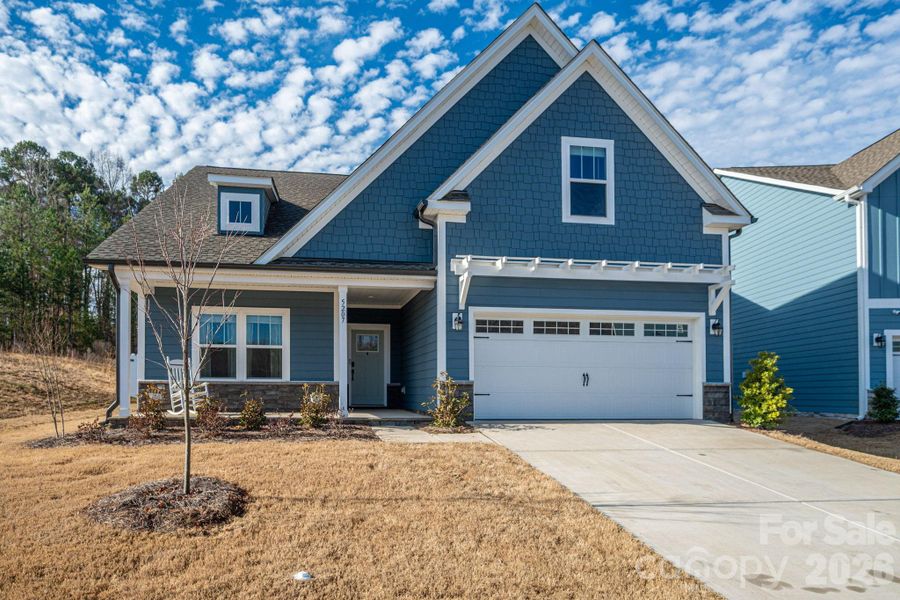 Front exterior of a new home in , Mount Holly, NC, highlighting curb appeal (Image 1). Front exterior of a new home in , Mount Holly, NC, highlighting curb appeal (Image 1).