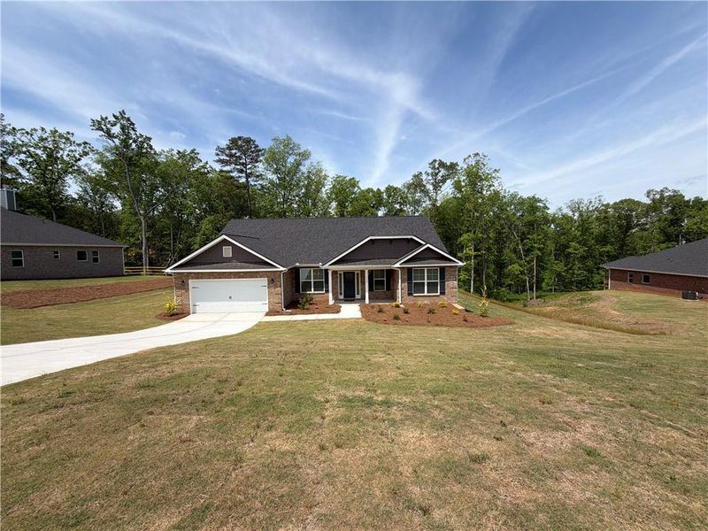 Front exterior of a new home in Tuscany Hills, Douglasville, GA, highlighting curb appeal (Image 1). Front exterior of a new home in Tuscany Hills, Douglasville, GA, highlighting curb appeal (Image 1).