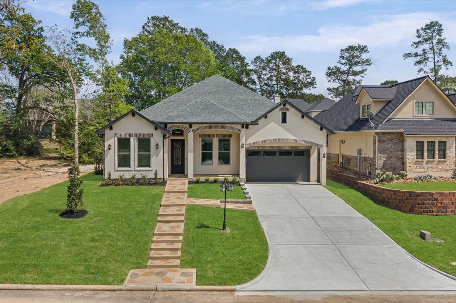 Front exterior of a new home in , Montgomery, TX, highlighting curb appeal (Image 22).
