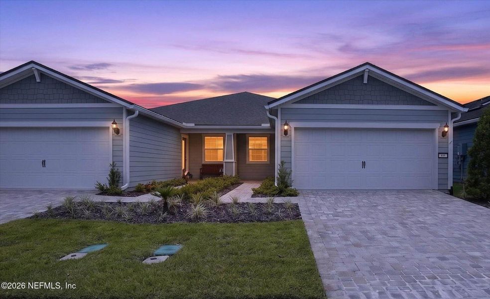Front exterior of a new home in Del Webb Wildlight, Wildlight, FL, highlighting curb appeal (Image 20). Front exterior of a new home in Del Webb Wildlight, Wildlight, FL, highlighting curb appeal (Image 20).
