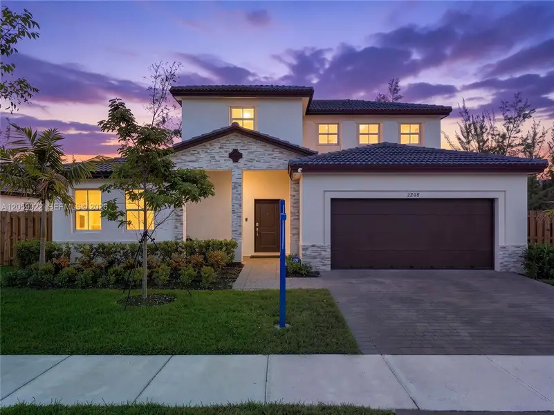 Front exterior of a new home in , Homestead, FL, highlighting curb appeal (Image 2). Front exterior of a new home in , Homestead, FL, highlighting curb appeal (Image 2).