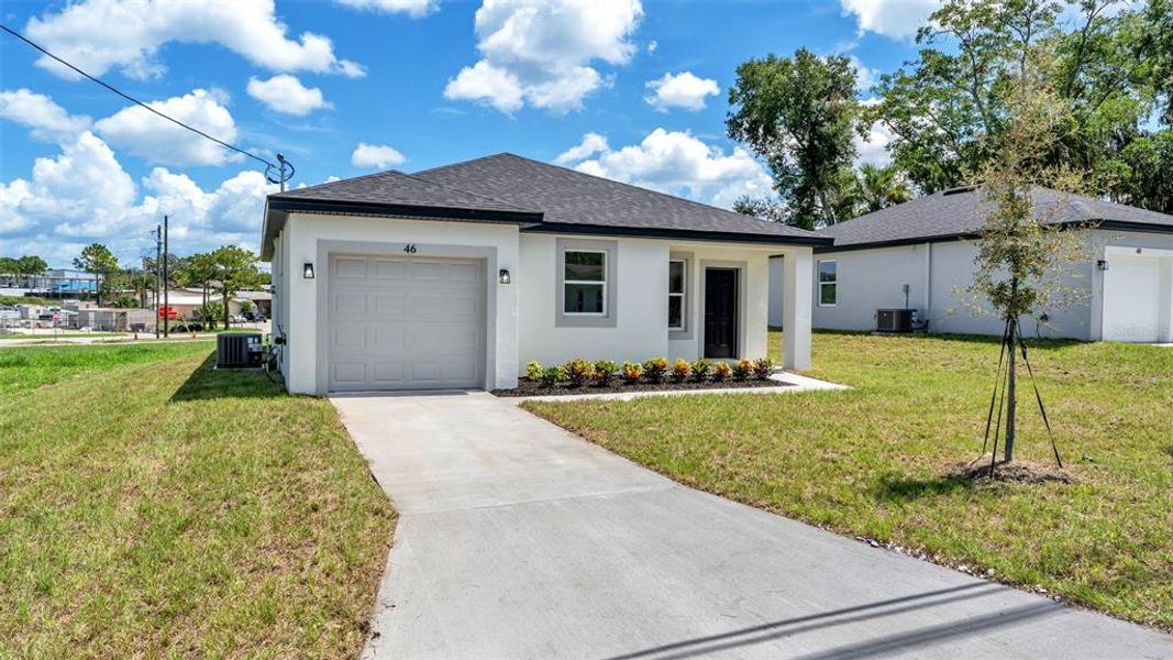 Front exterior of a new home in , Haines City, FL, highlighting curb appeal (Image 2). Front exterior of a new home in , Haines City, FL, highlighting curb appeal (Image 2).