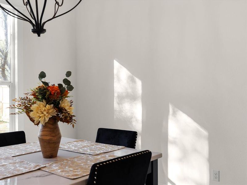 Dining space with a chandelier