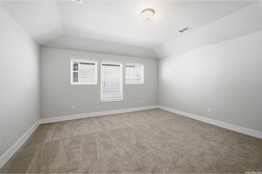 Spacious, unfurnished interior of a new home in The Woodlands at Medina Hills, Mico (Image 28).