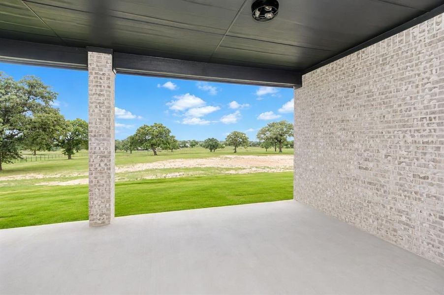 Exterior details and patio area of a home in , Poolville (Image 3).