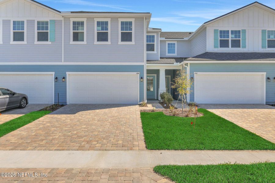 Front exterior of a new home in Brook Forest, St. Augustine, FL, highlighting curb appeal (Image 1). Front exterior of a new home in Brook Forest, St. Augustine, FL, highlighting curb appeal (Image 1).