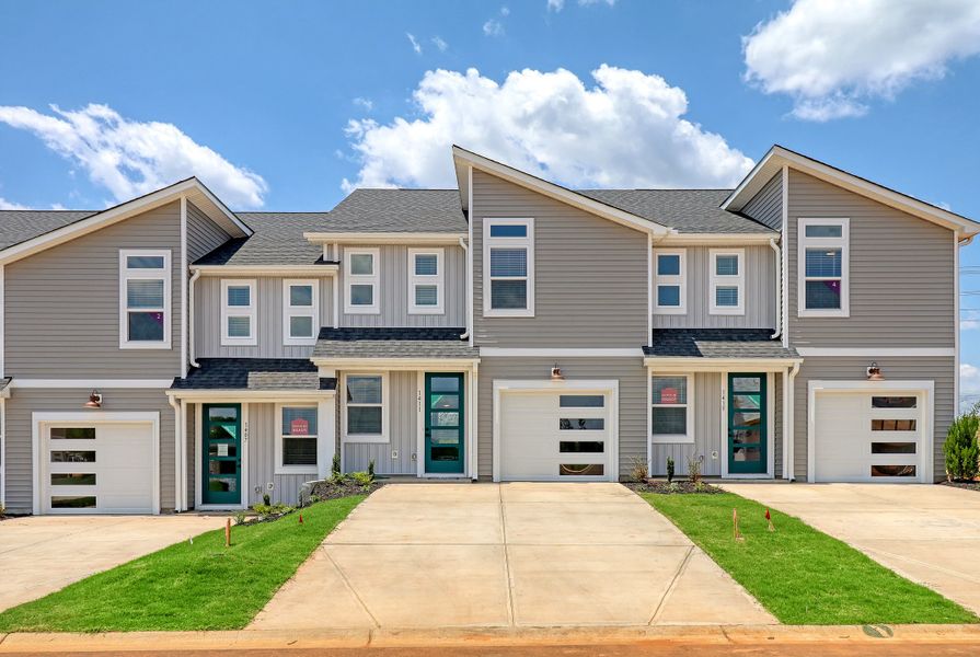 Exterior details and patio area of a home in Westgate Village Townes, Spartanburg (Image 1).