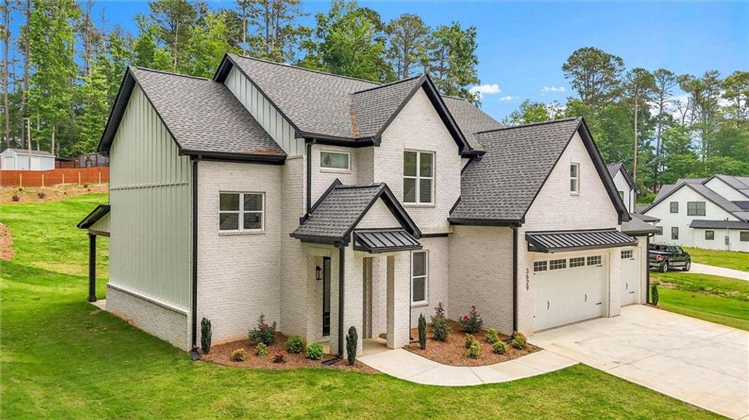 Front exterior of a new home in , Snellville, GA, highlighting curb appeal (Image 26).
