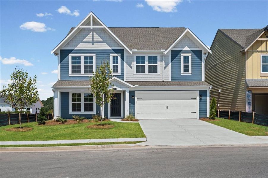 Front exterior of a new home in Twin Lakes, Hoschton, GA, highlighting curb appeal (Image 17). Front exterior of a new home in Twin Lakes, Hoschton, GA, highlighting curb appeal (Image 17).