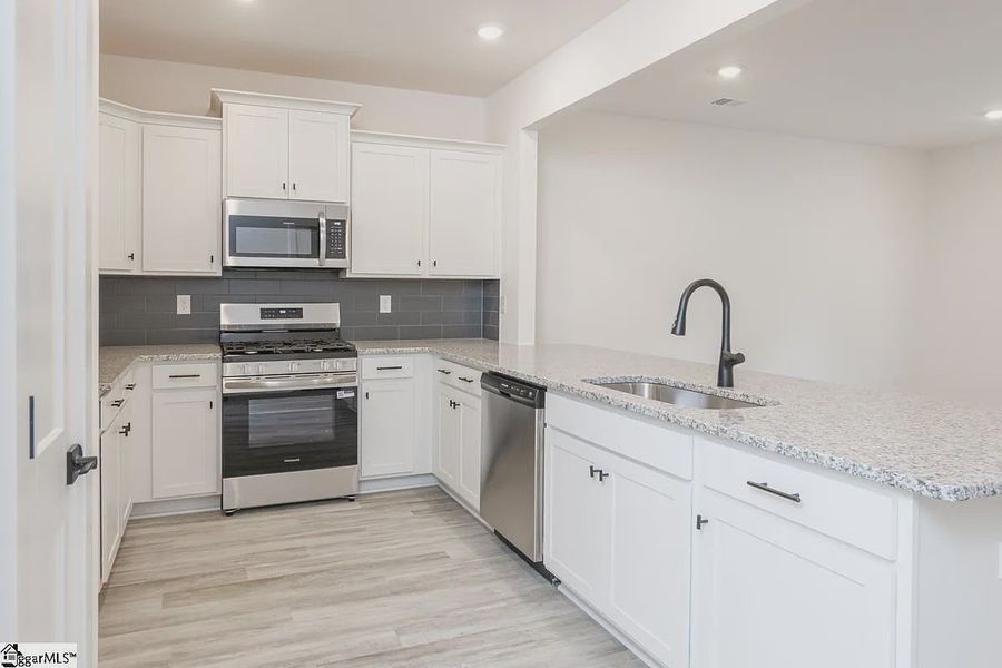 Representative furnished interior of a home built from the 1568 Townhome by Adams Homes in Parkstone Place Townhomes, Roebuck (Image 5). Representative furnished interior of a home built from the 1568 Townhome by Adams Homes in Parkstone Place Townhomes, Roebuck (Image 5).