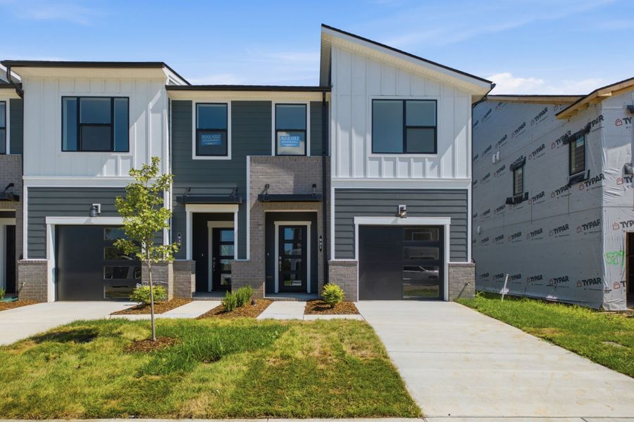 Front exterior of a new home in Nexus Townhomes, Gallatin, TN, highlighting curb appeal (Image 2). Front exterior of a new home in Nexus Townhomes, Gallatin, TN, highlighting curb appeal (Image 2).