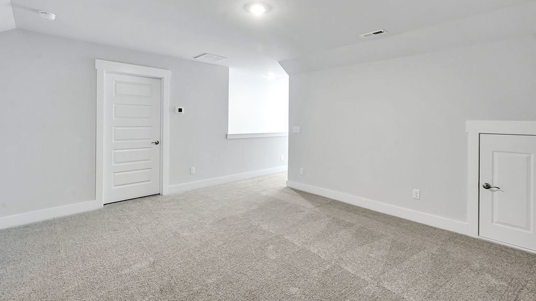 Spacious, unfurnished interior of a new home in The Haven at Indigo Preserve, Leland (Image 28).