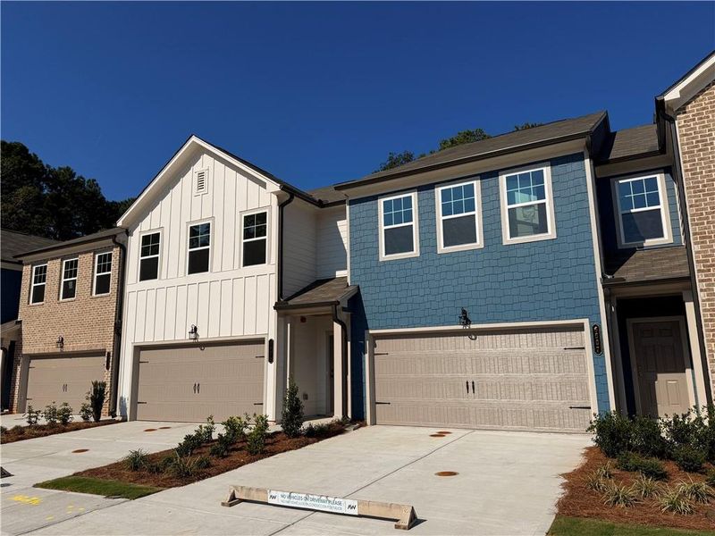 Front exterior of a new home in Laurelwood, Douglasville, GA, highlighting curb appeal (Image 24).