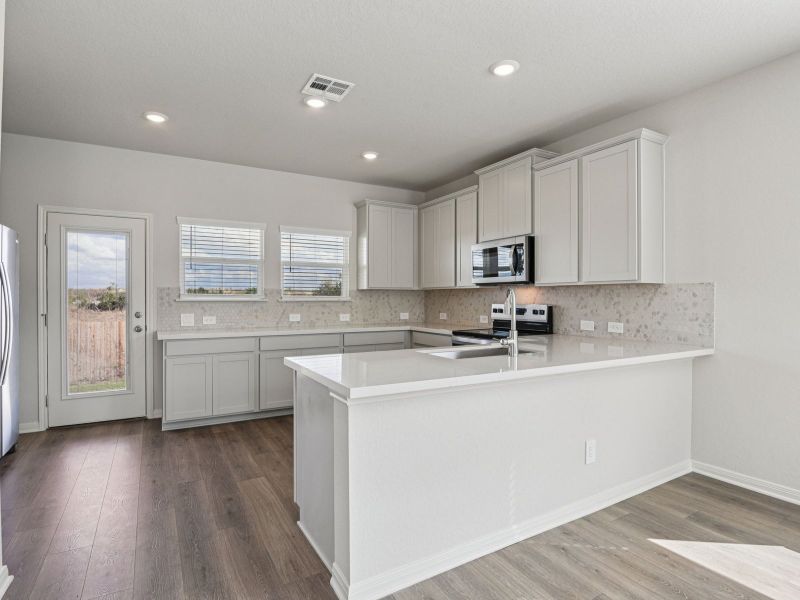 Furnished interior view inside a new home in Remington Ranch, San Antonio (Image 7).