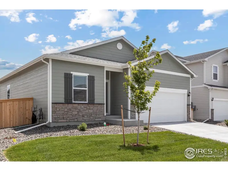 Front exterior of a new home in Hidden Valley Farm, Severance, CO, highlighting curb appeal (Image 1).