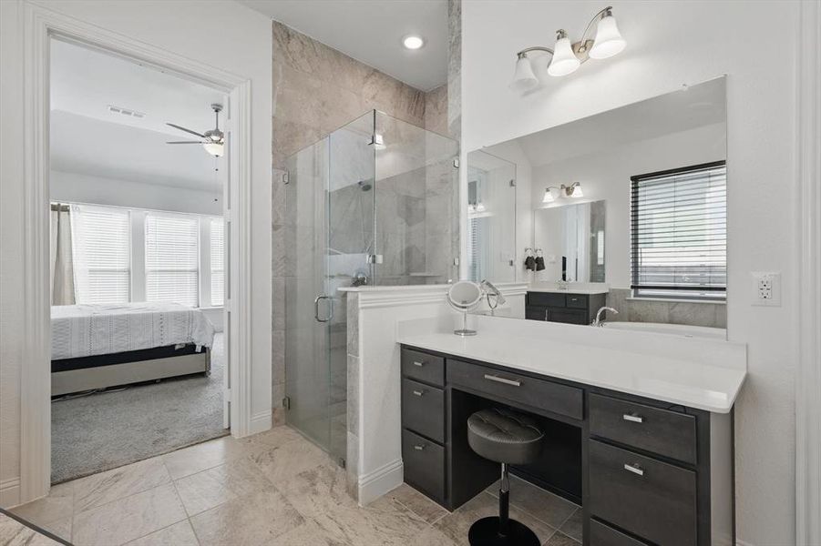 The Makeup Vanity is a special touch in this exceptionally large Primary Bath.