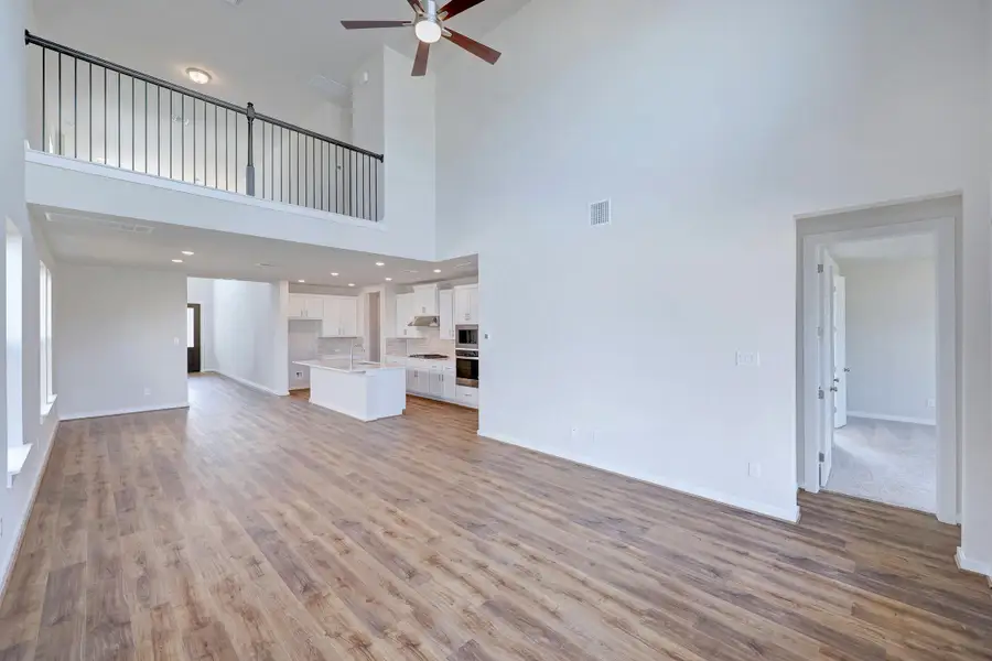 Representative unfurnished interior of a home built from the Travis by Scott Felder Homes in Flora, Hutto (Image 10).