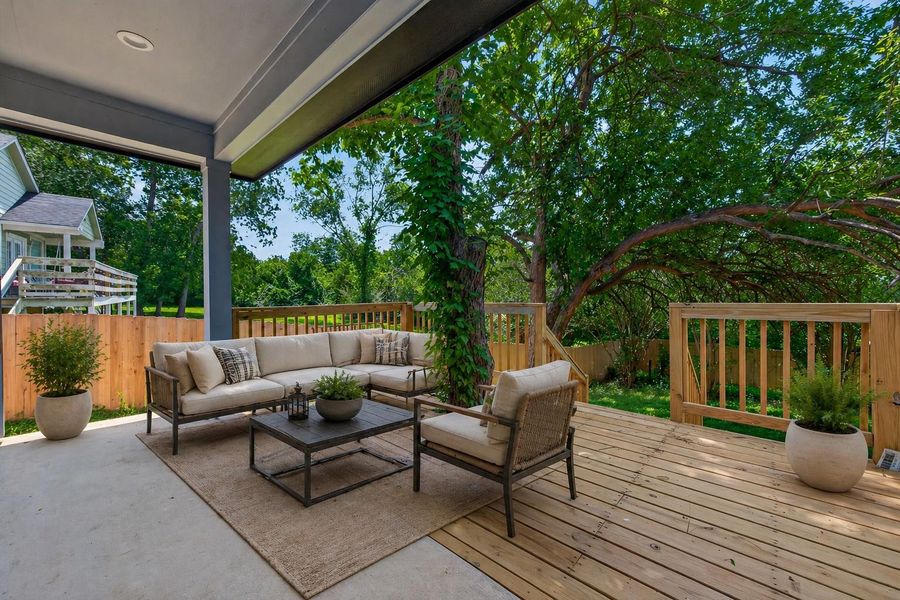 Large covered patio  for outdoor relaxation or entertaining. Virtually staged.