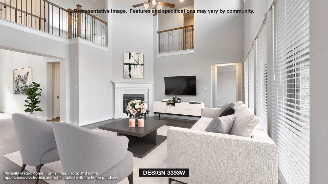 Living room with ceiling fan, a glass covered fireplace, and a towering ceiling Living room with ceiling fan, a glass covered fireplace, and a towering ceiling