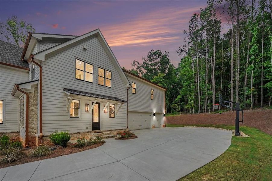 Front exterior of a new home in , Monroe, GA, highlighting curb appeal (Image 27). Front exterior of a new home in , Monroe, GA, highlighting curb appeal (Image 27).