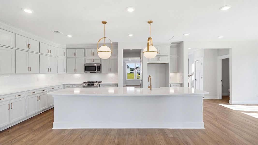 Stunning kitchen with a statement 12-foot island and floor-to-ceiling stacked cabinetry