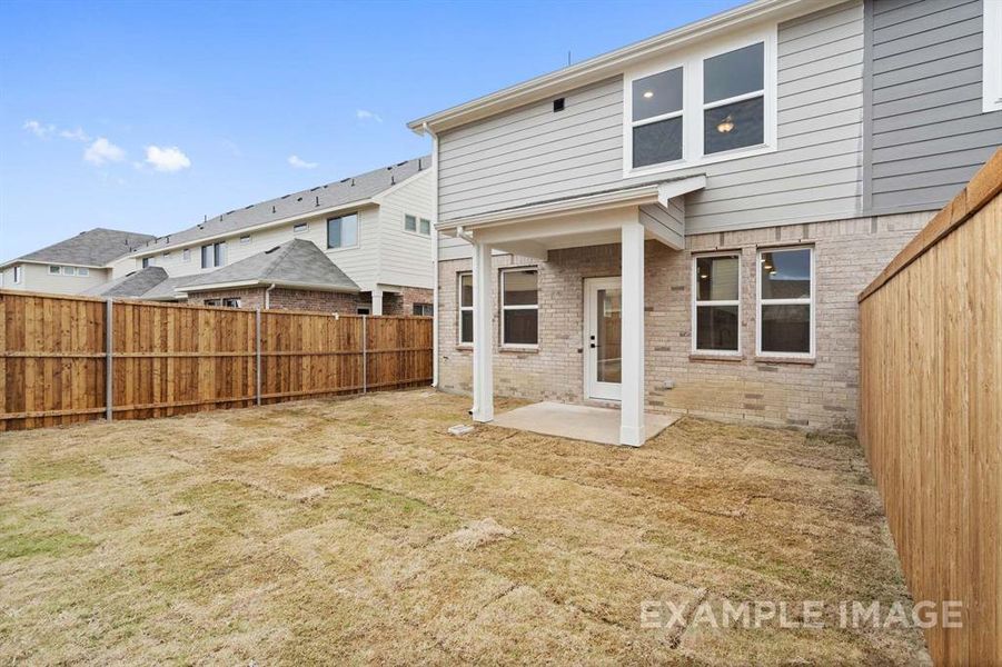 Back of property featuring a patio