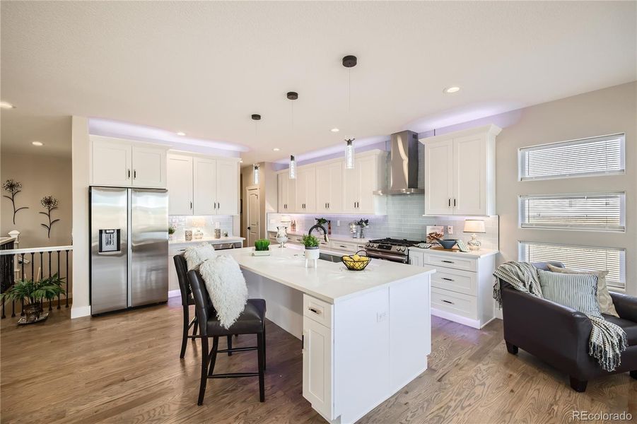 The custom-designed kitchen is a beauty! Notice the cabinet lighting...above, below, and floor. The lights can be different colors, too!