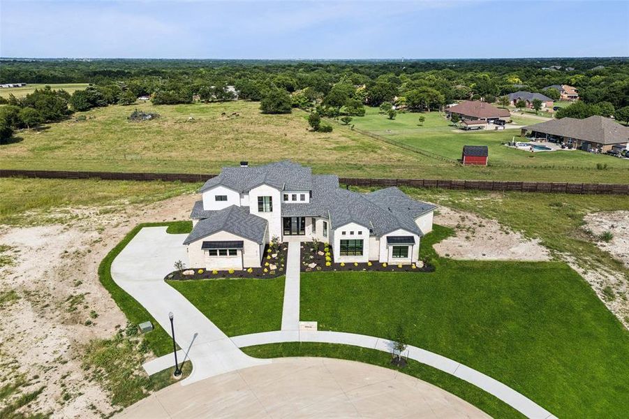 Front exterior of a new home in , Midlothian, TX, highlighting curb appeal (Image 25). Front exterior of a new home in , Midlothian, TX, highlighting curb appeal (Image 25).