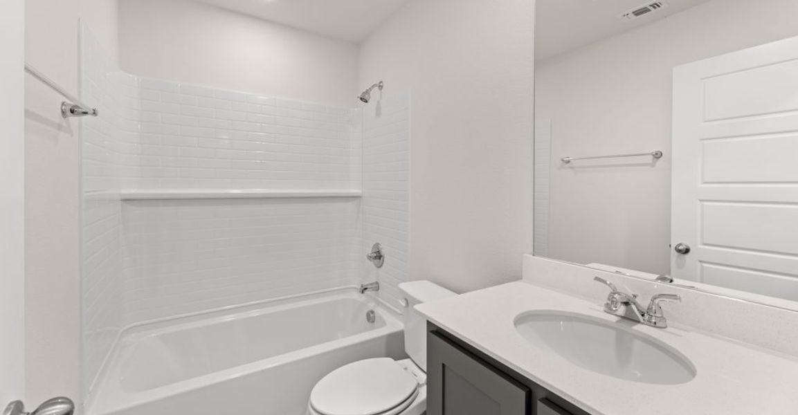 Representative exterior photo of a completed home built from the Caddo by Impression Homes in Creekshaw, Royse City, TX (Image 17).