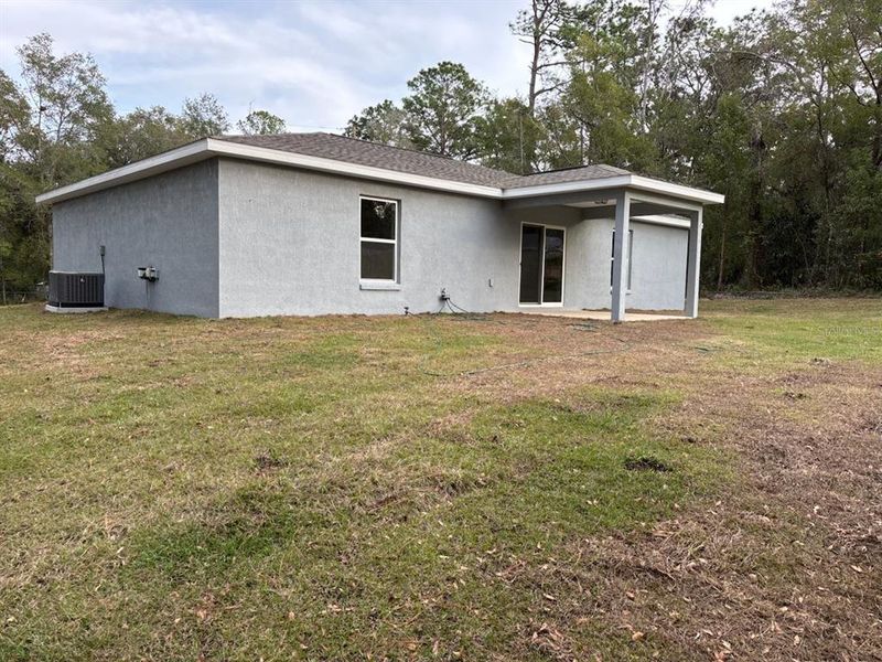 Exterior details and patio area of a home in , Citrus Springs (Image 18).