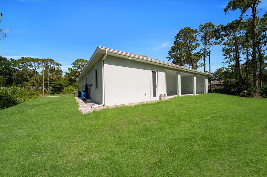 Exterior details and patio area of a home in , Lehigh Acres (Image 26). Exterior details and patio area of a home in , Lehigh Acres (Image 26).