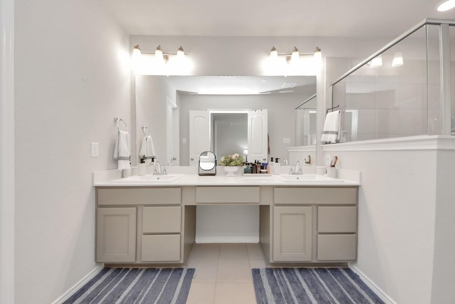 Another view of the primary bath room showing the dual sink and vanity area. Pretty fixtures and a very roomy space. Another view of the primary bath room showing the dual sink and vanity area. Pretty fixtures and a very roomy space.