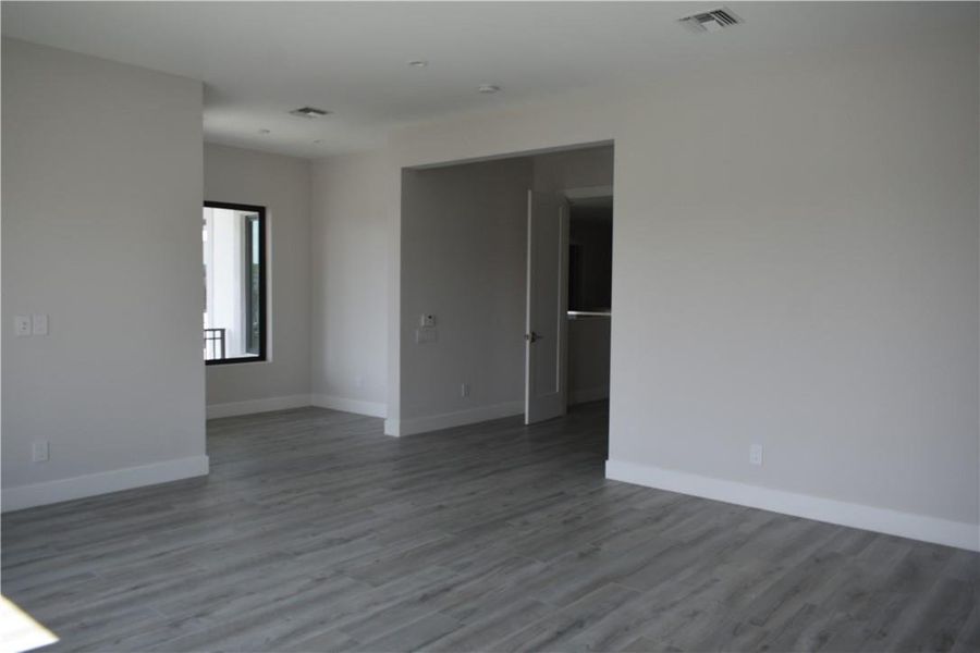 Photo from previously built Deerwood Model Home.  Master Bedroom with  Sitting Area and Balcony