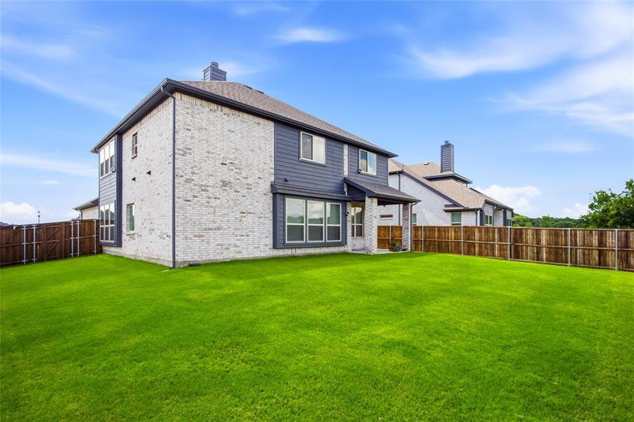 Exterior details and patio area of a home in , Providence Village (Image 4). Exterior details and patio area of a home in , Providence Village (Image 4).