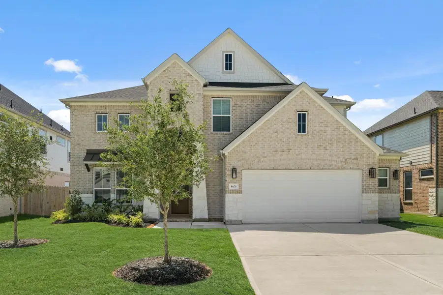 Front exterior of a new home in Briarwood Crossing, Rosenberg, TX, highlighting curb appeal (Image 2).