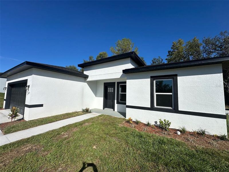 Front exterior of a new home in , Citrus Springs, FL, highlighting curb appeal (Image 28).
