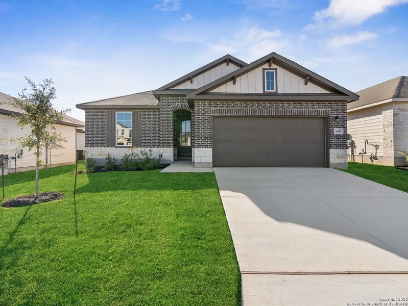 Front exterior of a new home in Morgan Meadows, San Antonio, TX, highlighting curb appeal (Image 1). Front exterior of a new home in Morgan Meadows, San Antonio, TX, highlighting curb appeal (Image 1).