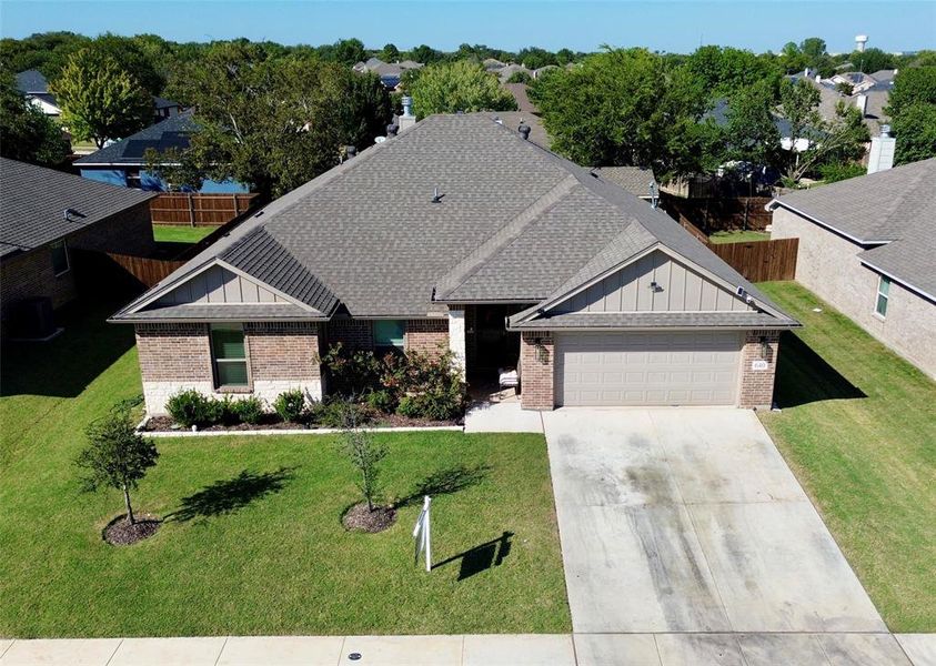 Front of Home concrete driveway, an attached garage, and a front yard Front of Home concrete driveway, an attached garage, and a front yard