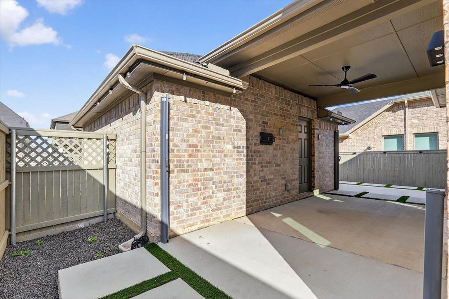 Covered back patio, leads to the 2 car garage