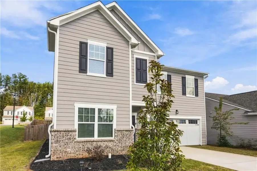 Front exterior of a new home in , Covington, GA, highlighting curb appeal (Image 22).