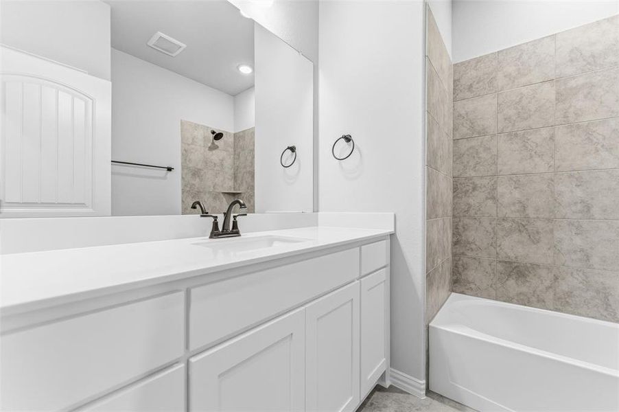 Full bathroom featuring vanity and bathtub / shower combination
