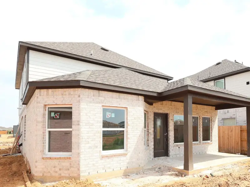Front exterior of a new home in Marvida, Cypress, TX, highlighting curb appeal (Image 1).