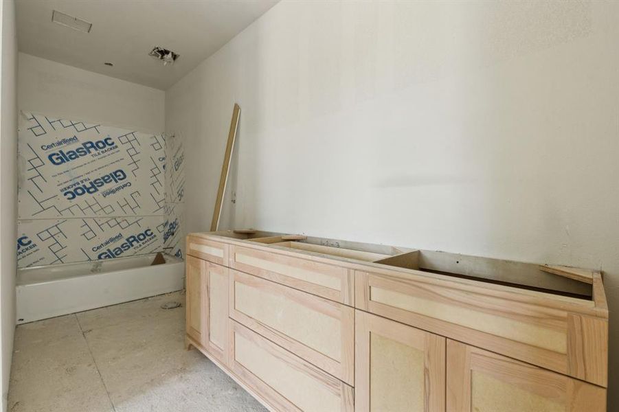 Second floor full bath with double sinks.